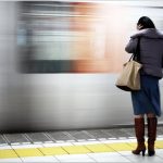 person beside high speed train